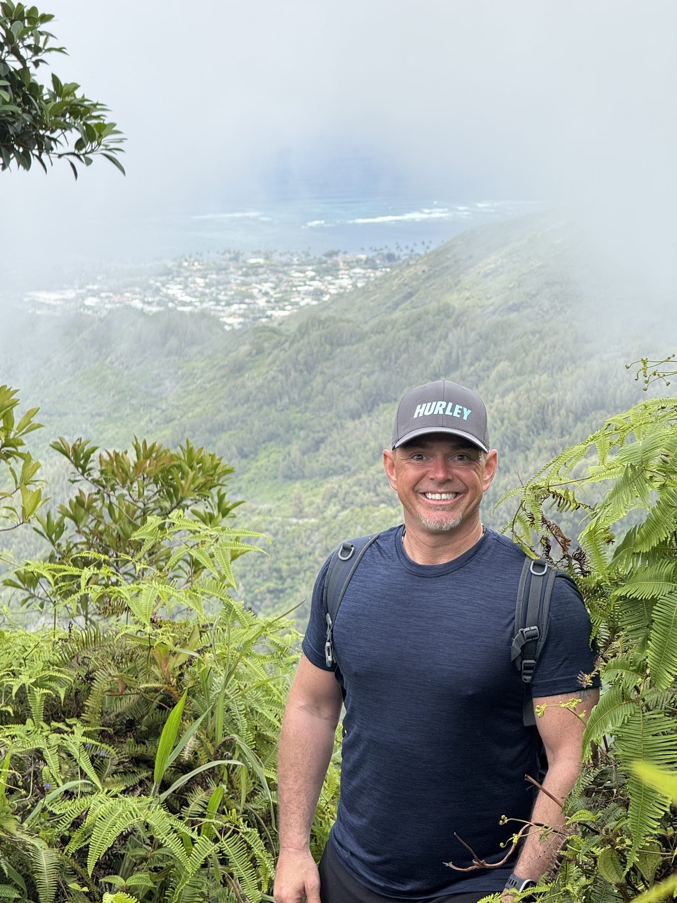 Pete on a misty mountain trail with a hiking pack